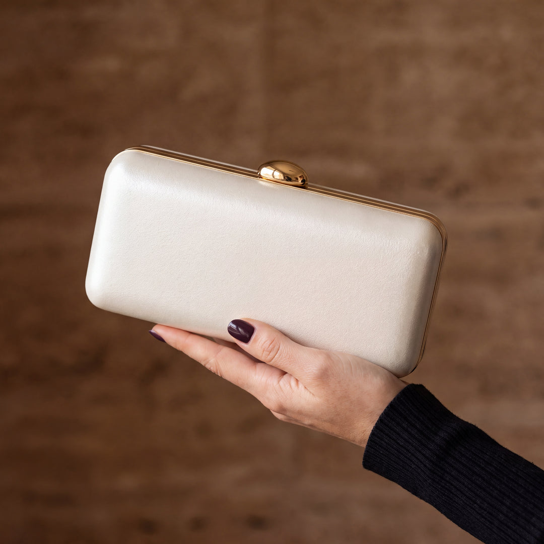 Serata Clutch Bag - Ivory, in hand