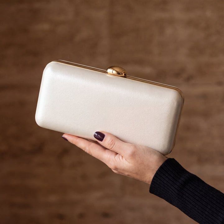 Serata Clutch Bag - Ivory, in hand