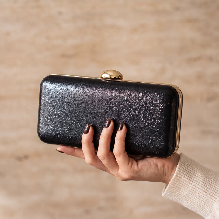 Serata Clutch Bag - Black, in hand