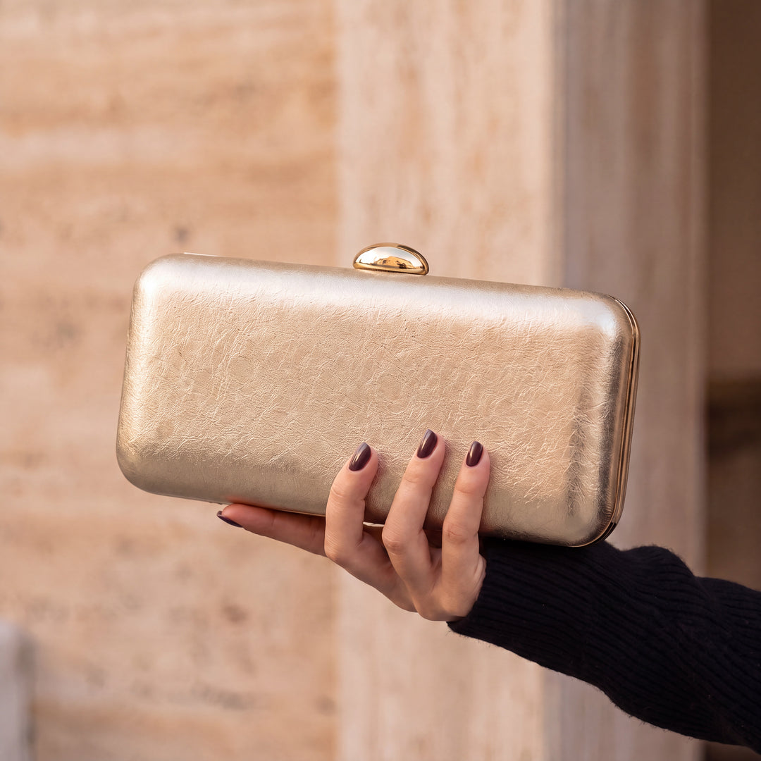 Serata Clutch Bag - Gold, in hand